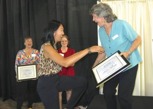 Board member Diana Taylor presents Writer of the Year award to Arlene Pellicane.